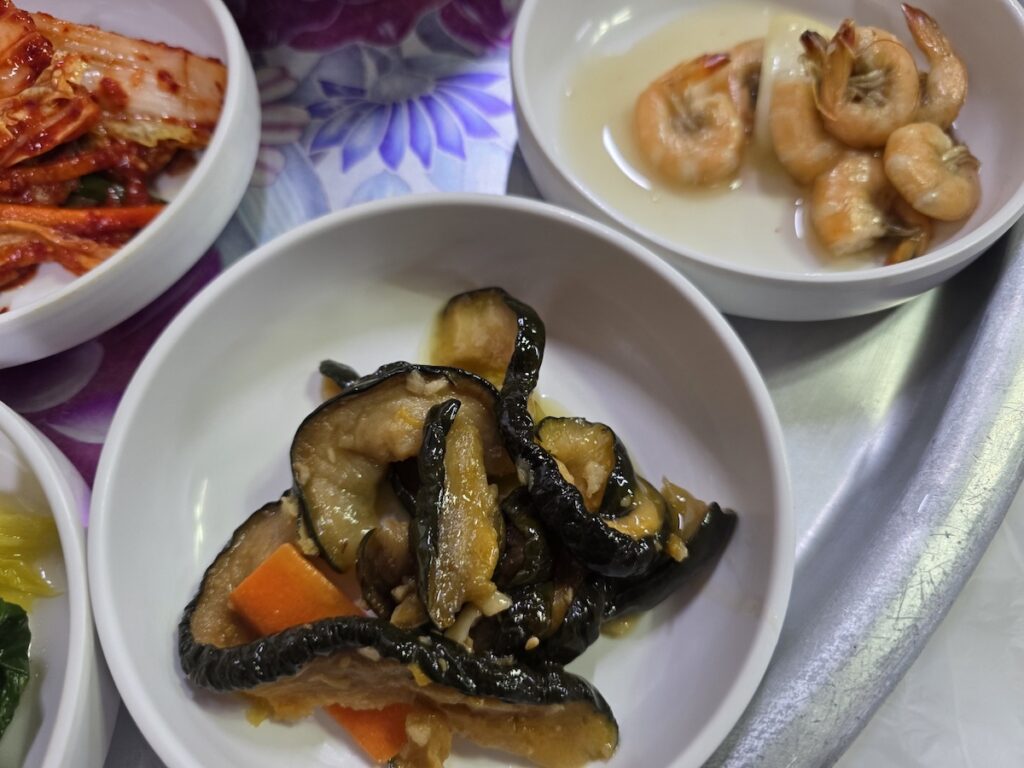 8 Vegan Banchan Secrets for a Stress-Free Korean Food Trip featuring blanched cabbage and green seaweed namul