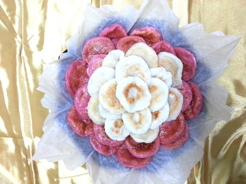 An artistic flower-shaped Tteok-cake made from rice flour, a unique part of the traditional cake culture in Korea.