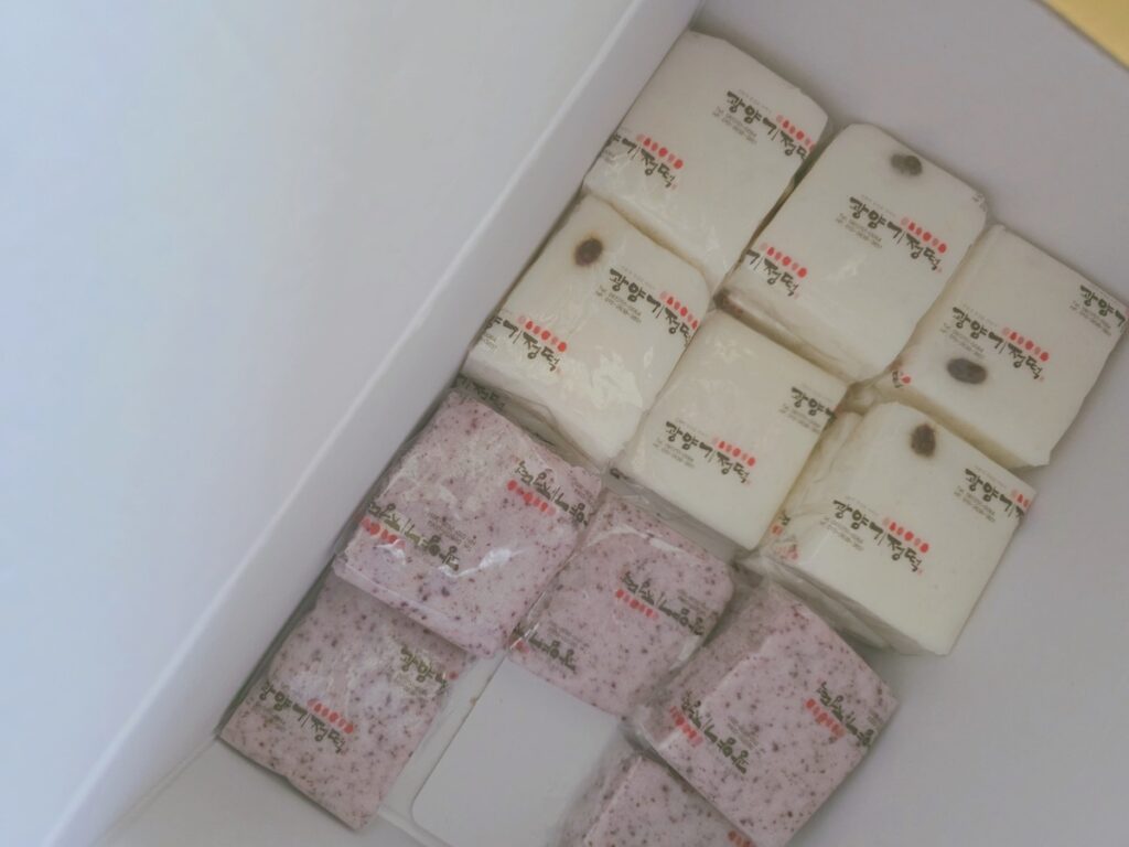 A box of individual plant-based Korean rice cake Tteok, perfect for a gluten-free diet secret.