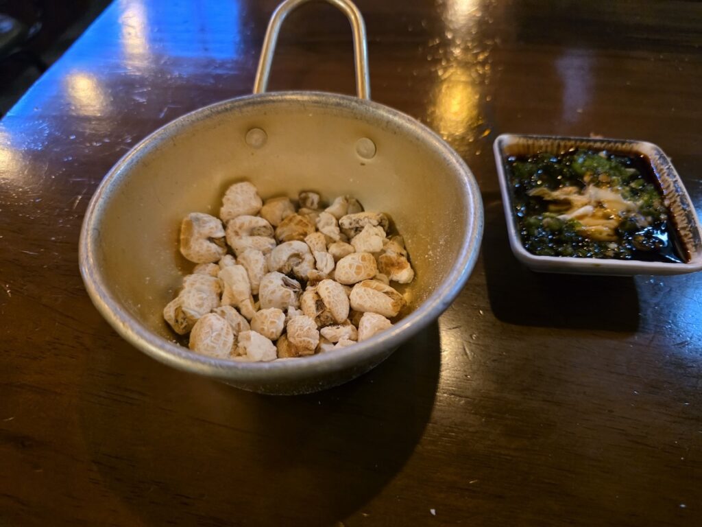 Traditional dried corn snacks and the signature sauce used in **Korean 2-cha Culture 2026**.