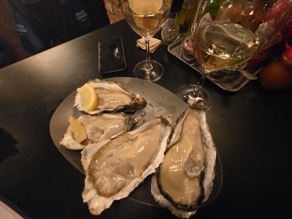 Fresh oysters in Korea at a Seoul oyster bar served with lemon and wine